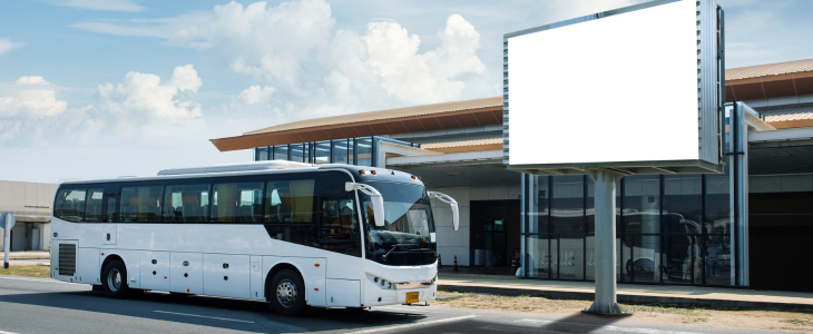 airport shuttle bus staging at a terminal
